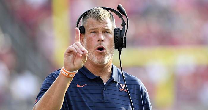 Virginia Cavaliers offensive line coach Garett Tujague reacts during the second half against the Louisville Cardinals at Cardinal Stadium.